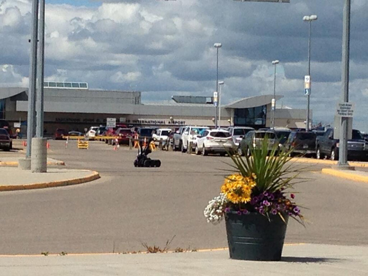 Saskatoon police are investigating a possible suspicious package in the parking lot at the airport.