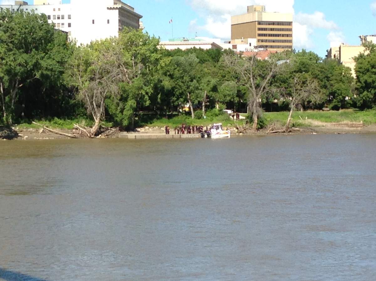 Winnipeg Police near the Alexander docks where a body was pulled from the water on Saturday.