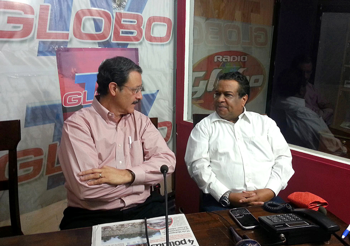 File - Honduran journalist Anibal Barrow (R) speaks with Honduran Presidential candidate for the Liberal Party, Mauricio Villeda, during an interview in San Pedro Sula, 240kms north of Tegucigalpa, on June 21, 2013.