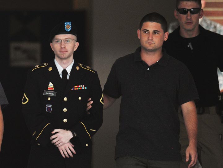 Army Pfc. Bradley Manning is escorted from court on July 25, 2013 in Fort Meade, Maryland on July 25, 2013.  