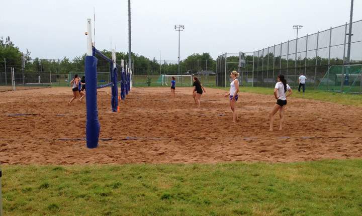 Members of the Canada Games beach volleyball team test out the new courts, in Burnside. 