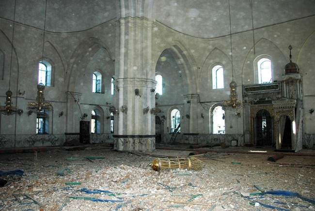 This Saturday, July 27, 2013 photo released by the Syrian official news agency SANA, shows the inside of the Khalid Ibn al-Walid Mosque in the heavily disputed northern neighborhood of Khaldiyeh, in Homs, Syria. Syrian government forces captured a historic mosque in the central city of Homs on Saturday.