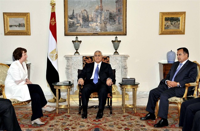In this image released by the Egyptian Presidency, Egyptian interim President Adly Mansour, center, meets with European Union foreign policy chief Catherine Ashton, left, and Egypt's Minister of Foreign Affairs, Nabil Fahmy, right, at the Presidential Palace in Cairo, Egypt, Monday, July 29, 2013. Egyptian police detained two leaders of a Muslim Brotherhood-allied party in the latest in a wave of arrests of prominent Islamists following President Mohammed Morsi’s ouster, while Europe’s top diplomat held talks with the rival sides Monday to try to mediate an end to the country’s increasingly bloody crisis. 