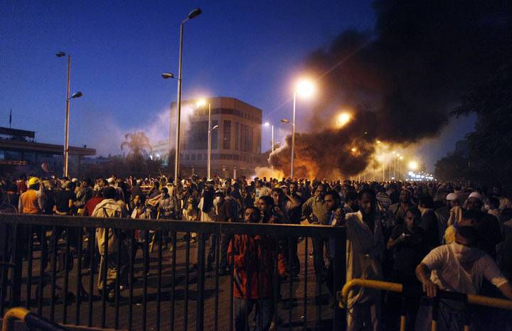 Egyptian supporters of the Muslim Brotherhood rallying in support of deposed president Mohamed Morsi clash with police outside the elite Republican Guards base in Cairo early on July 8, 2013.