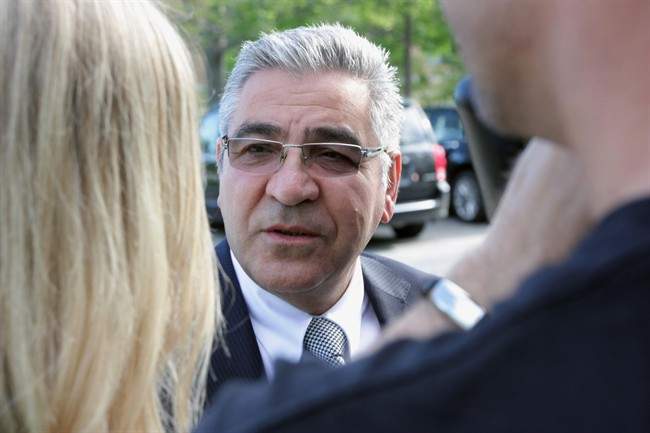 Bob Nazarian, owner of the ill-fated Algo Centre Mall, talks to reporters ahead of testifying at the inquiry into the mall's collapse in Elliot Lake, Ont., on Tuesday, July 23, 2013.