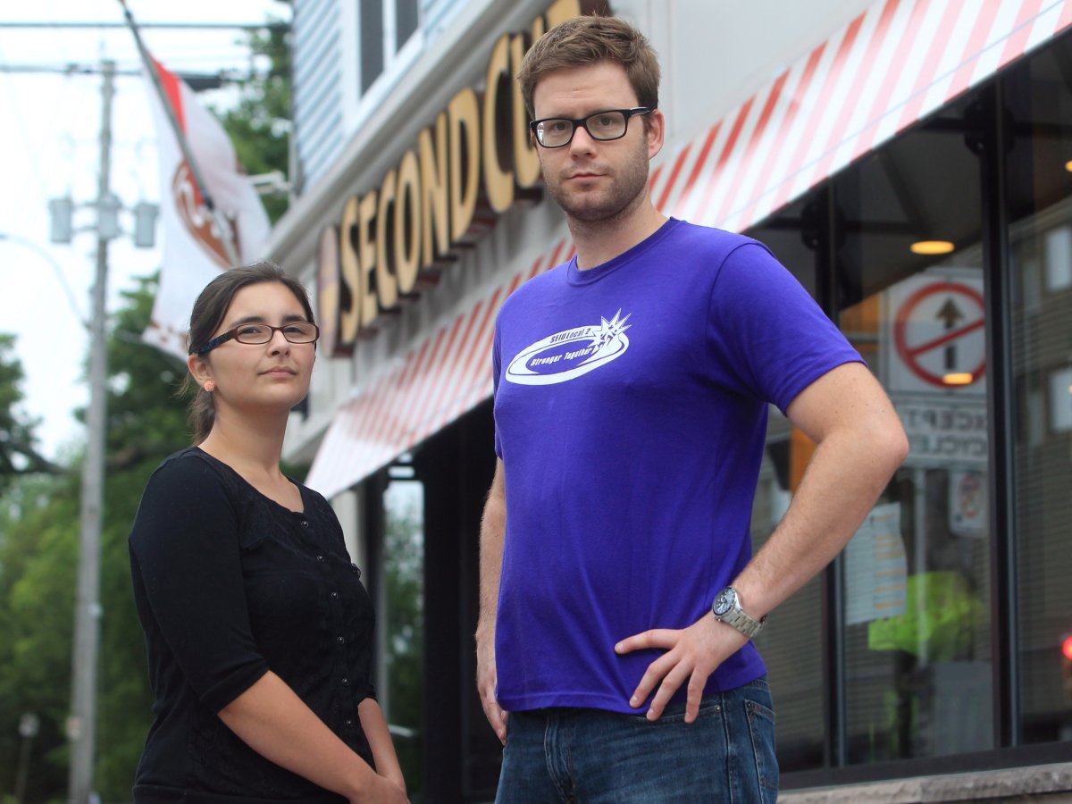 Second Cup employee Shelby Kennedy (left) and union representative Jason Edwards stand outside a Second Cup coffee shop on Friday, May 5, 2013 in Halifax, Nova Scotia. The two are part of a drive to unionize baristas working in the Halifax area, which they believe can be used as a model across the country.