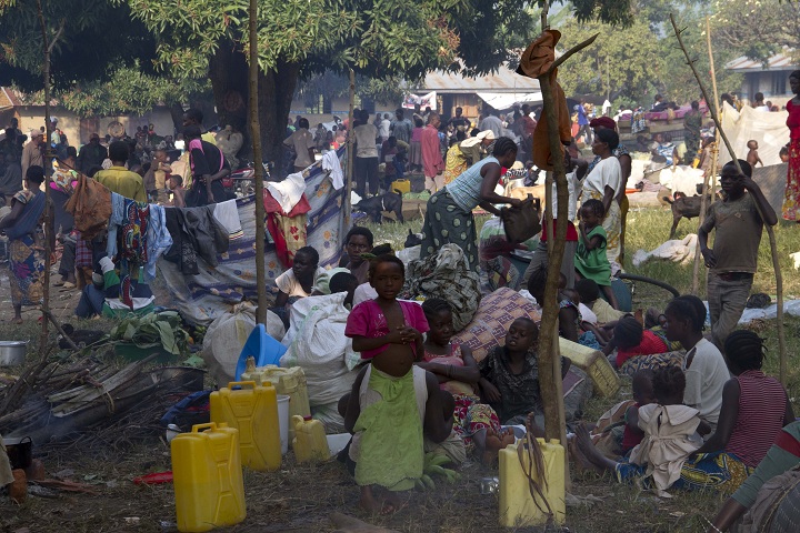 Refugees from eastern Democratic Republic of Congo (DRC) wait on July 13, 2013 at the Busunga border in western Uganda. More than 30,000 refugees from the eastern DRC have crossed the border into western Uganda's Bundibugyo district, about 430 kms from Kampala, after rebels from a Ugandan-led rebel group, the Allied Democratic Forces (ADF), attacked on July 11 the town of Kamango in the northernmost part of North Kivu province.
