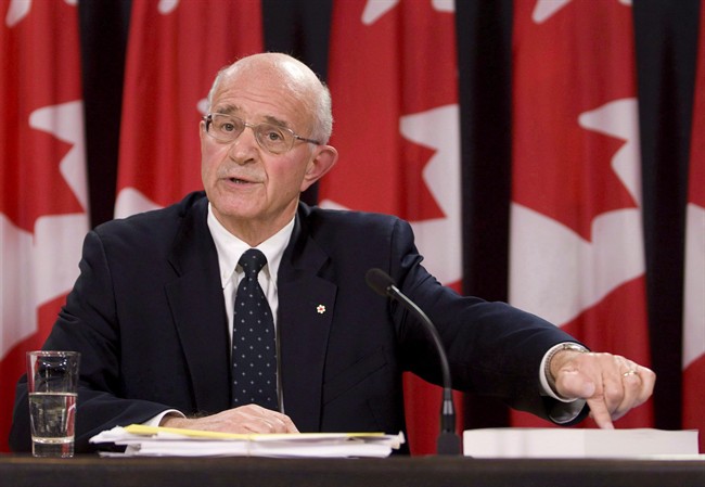 Ret. justice Frank Iacobucci points to a report in Ottawa on Oct. 21, 2008. THE CANADIAN PRESS/Adrian Wyld