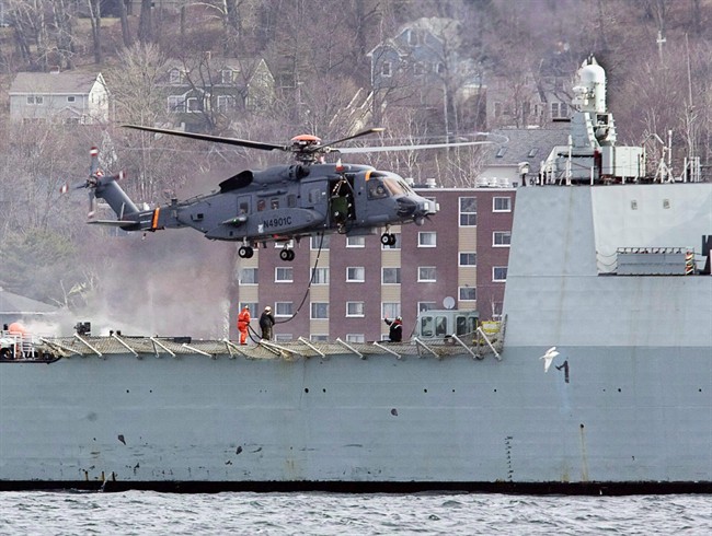 A Canadian military CH-148 Cyclone conducts training exercises with HMCS Montreal in Halifax harbour on March 29, 2010.