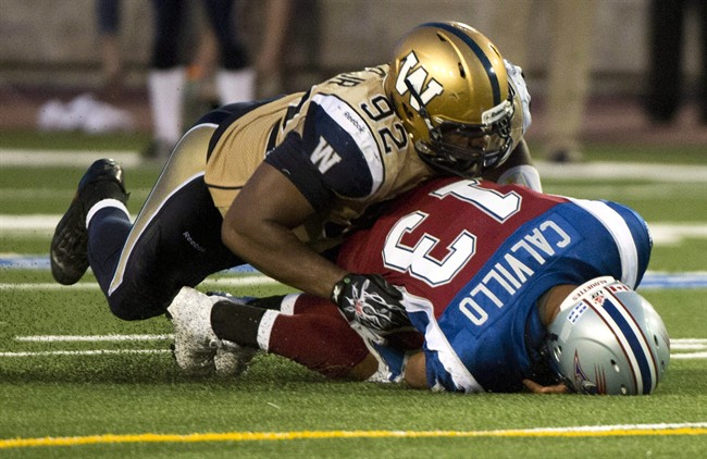 Winnipeg Blue Bombers defensive tackle Bryant Turner sacks Montreal Alouettes quarterback Anthony Calvillo in Montreal in 2013.