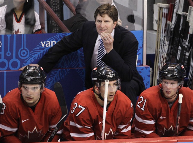 Canada head coach Mike Babcock watches as his team plays Germany in the second period of a men's playoff qualifying round ice hockey game at the Vancouver 2010 Olympics in Vancouver, British Columbia, Feb. 23, 2010. 