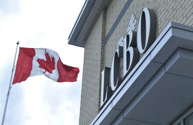 A Canadian flag flies near an LCBO store in Bowmanville, Ontario on Saturday July 20, 2013.