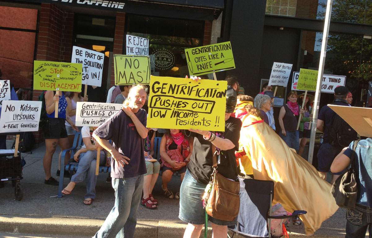 Demonstrators gather outside the Cuchillo restaurant on Powell St in Vancouver.