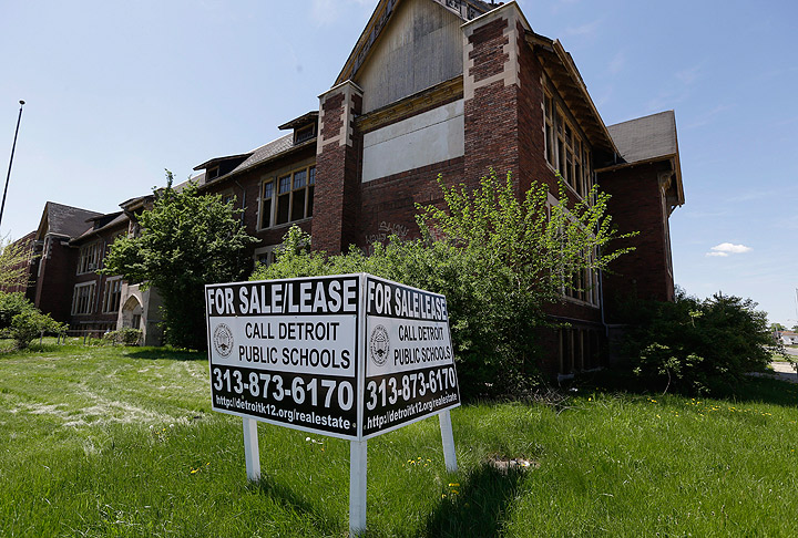 In this May 16, 2013 photo, a for sale/lease sign is displayed at the vacant Crosman Alternative School in Detroit which closed in 2007. 