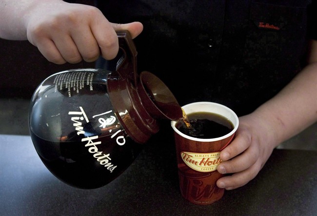 A cup of Tim Hortons coffee is poured.