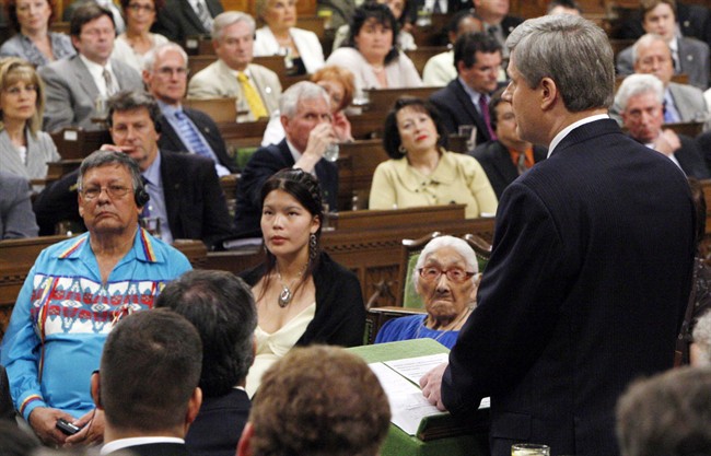 Residential school victims listen to Prime Minister Stephen Harper officially apologize for more than a century of abuse and cultural loss involving Indian residential schools in Ottawa, on June 11, 2008.