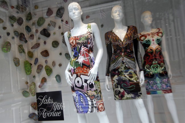 In this July 19, 2012, photo, dresses are on display in the Saks Fifth Avenue flagship store's window in New York. THE CANADIAN PRESS/AP, Mary Altaffer