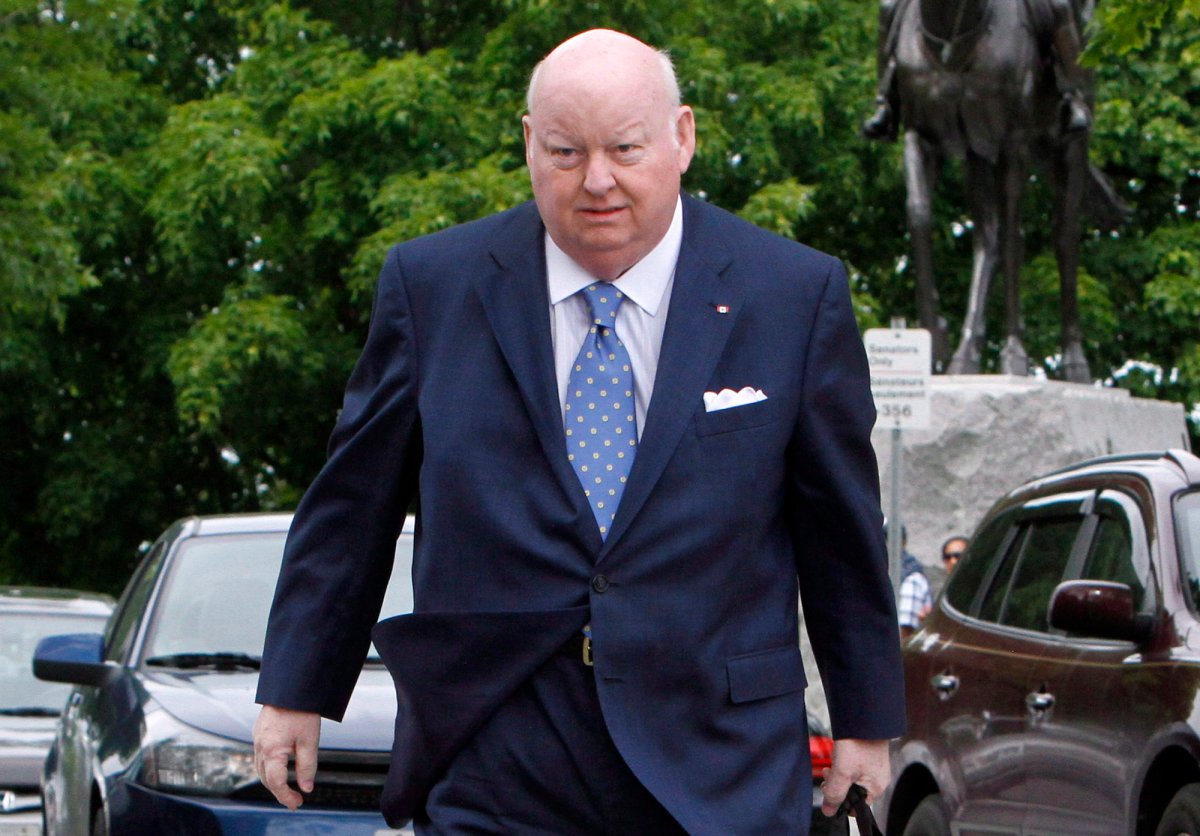 Sen. Mike Duffy makes his way to the Senate on Parliament Hill, Tuesday, May 28, 2013 in Ottawa. 