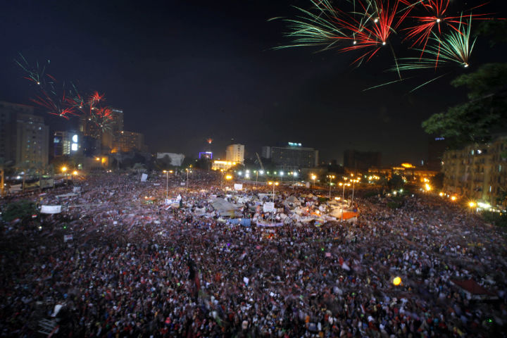 Fireworks light the sky as opponents of Egypt's Islamist President Mohammed Morsi celebrate in Tahrir Square in Cairo, Egypt, Wednesday, July 3, 2013.