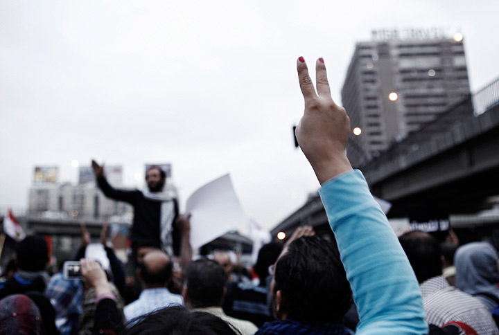 n Egyptian protester makes a ‘v for victory’ sign during a demonstration against Egyptian President Mohammed Morsi on December 4 in in Cairo, Egypt.