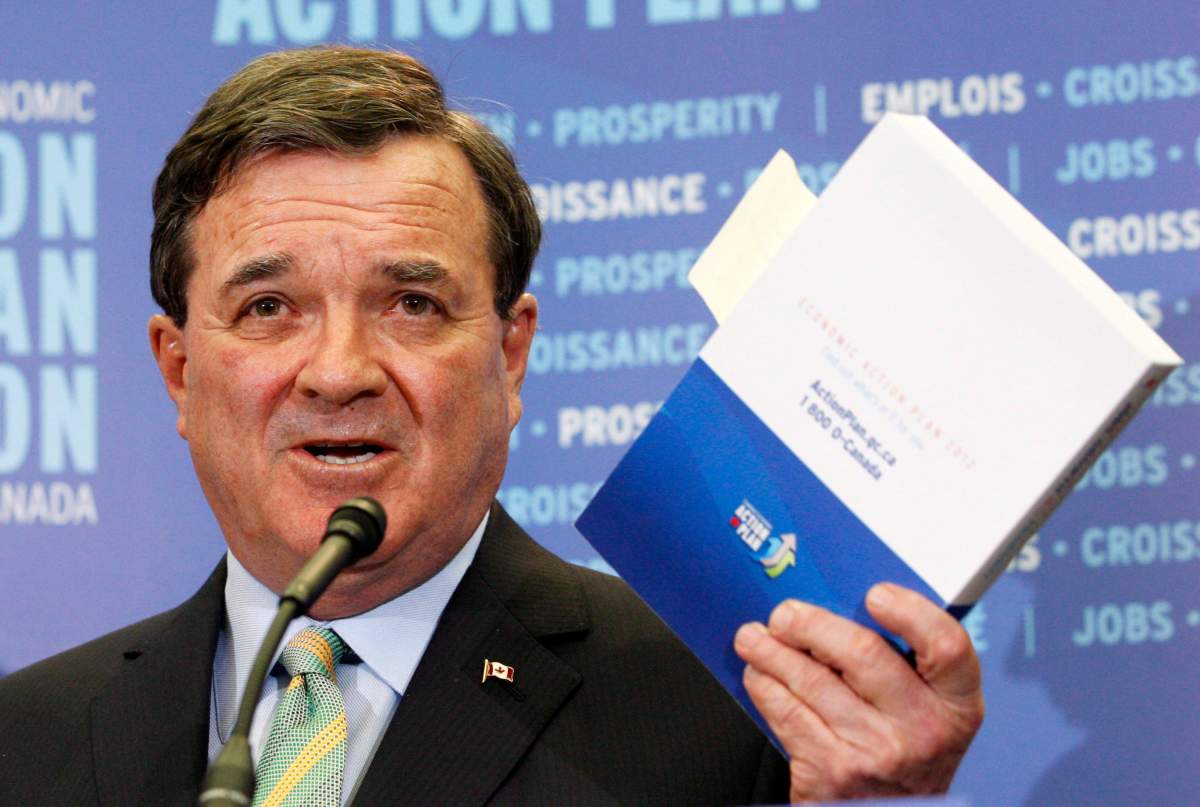 Finance Minister Jim Flaherty answers questions in the lockup prior to the release of the federal budget in Ottawa Thursday, March 29, 2012. Opposition MPs who sit on a key House of Commons committee are poised to ask the government to turn over key financial documents in the run-up to the federal budget. THE CANADIAN PRESS/Adrian Wyld.