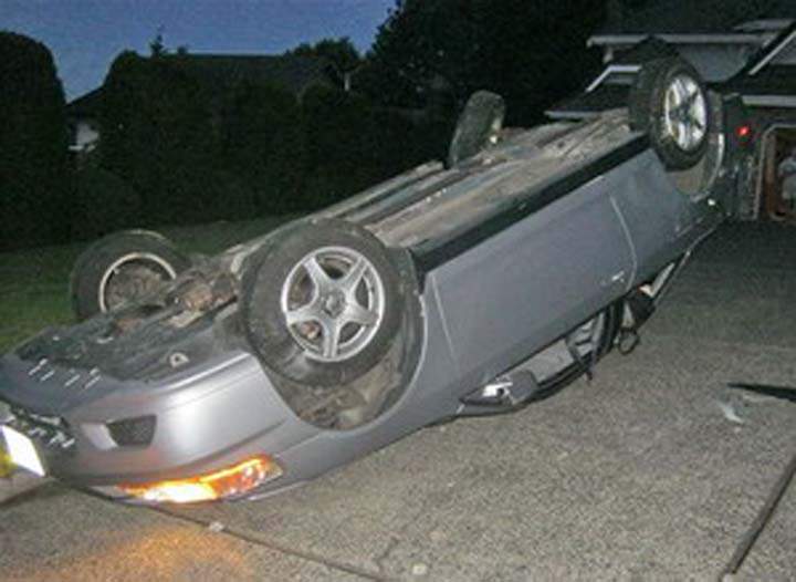 After hearing a loud crash, residents of a house in Coquitlam found this car flipped in their driveway on July 3.