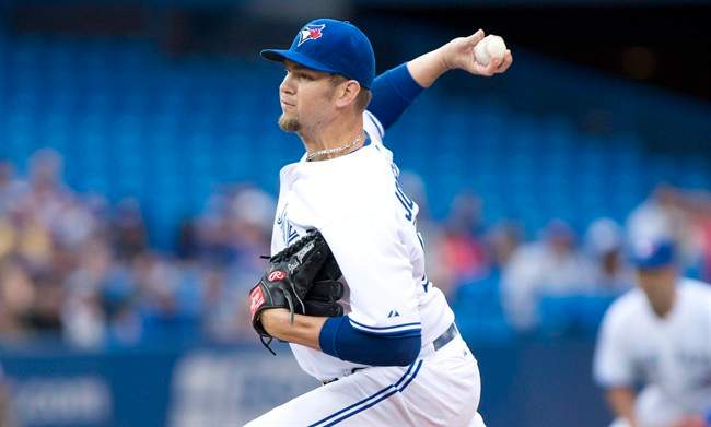 Toronto Blue Jays starting pitcher Josh Johnson throws during the first inning of a game against the Los Angeles Dodgers in Toronto on Monday July 22, 2013.
