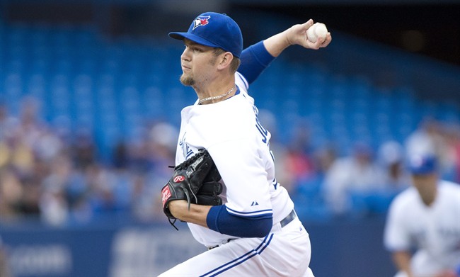 Toronto Blue Jays starting pitcher Josh Johnson throws during the first inning of a game against the Los Angeles Dodgers in Toronto on Monday July 22, 2013.