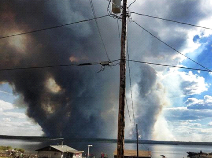 Smoke from wildfire forces evacuations in Fond du-Lac, Saskatchewan.