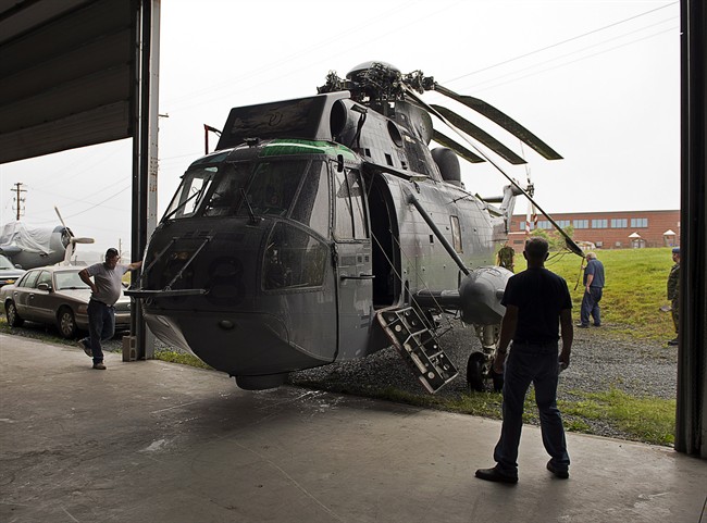 A Royal Canadian Air Force Sea King helicopter is moved to the Shearwater Aviation Museum on Monday, July 29, 2013. 