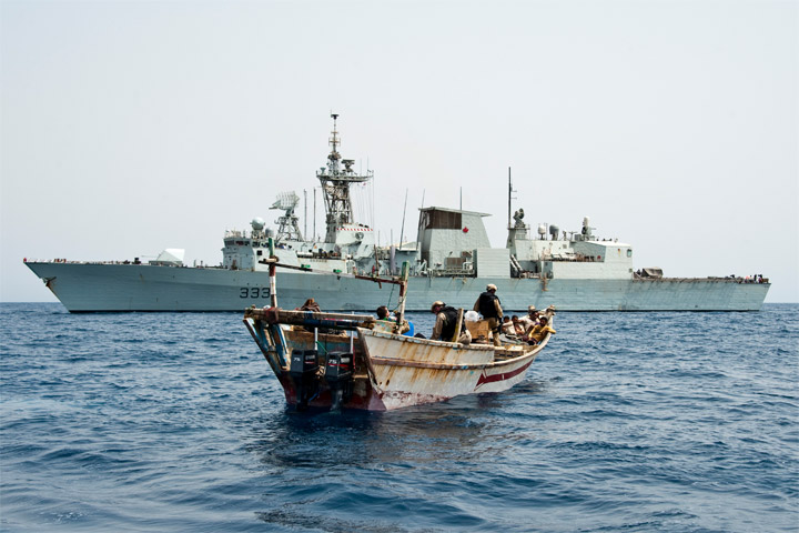 HMCS TORONTO's boarding party searches a skiff in the Red Sea and recovers 249 kilograms of narcotics on June 28, 2013 as part of Operation ARTEMIS.

