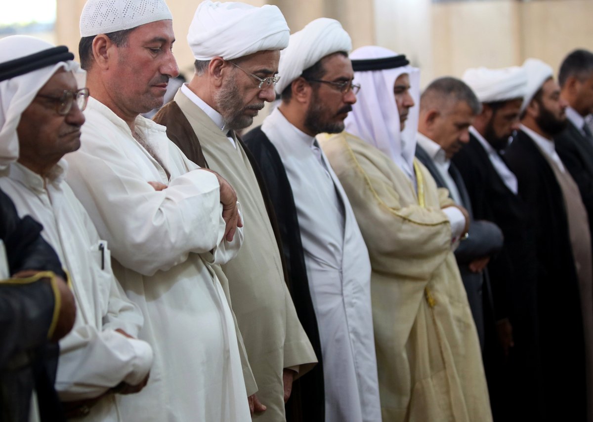 Iraqi Sunni and Shiite Muslim worshipers perform a joint Ramadan Friday prayer in central Baghdad on July 26, 2013. Iraq has faced years of attacks by militants, but analysts say widespread discontent among members of its Sunni Arab minority that the government has failed to address has fuelled the surge this year.