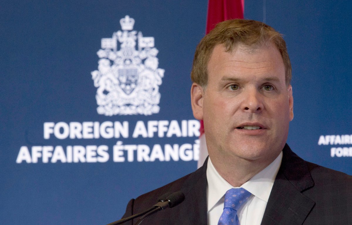 Canada's official-languages commissioner has asked John Baird to dump his English-only business cards.