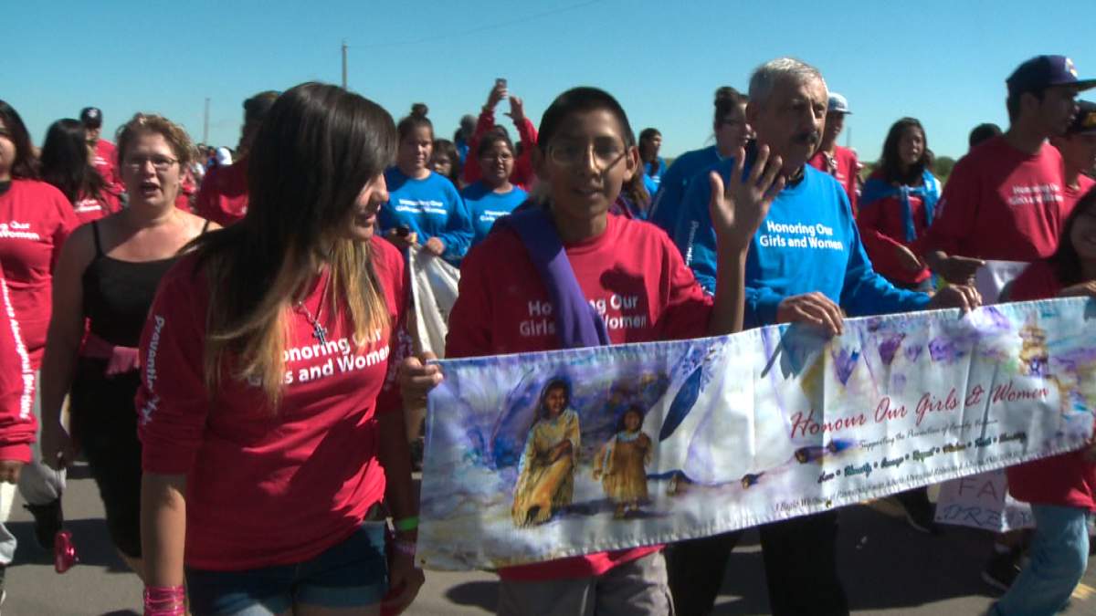 First nations youth walk in a colorful parade on the Blood Reserve, bringing awareness to violence against women during  the 10th Annual Youth Gathering. 