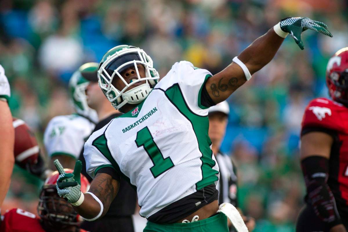 Saskatchewan Roughriders running back Kory Sheets celebrates a touchdown in the first quarter of CFL pre-season football action against the Calgary Stampeders in Regina, Sask., Thursday, June 20, 2013. 