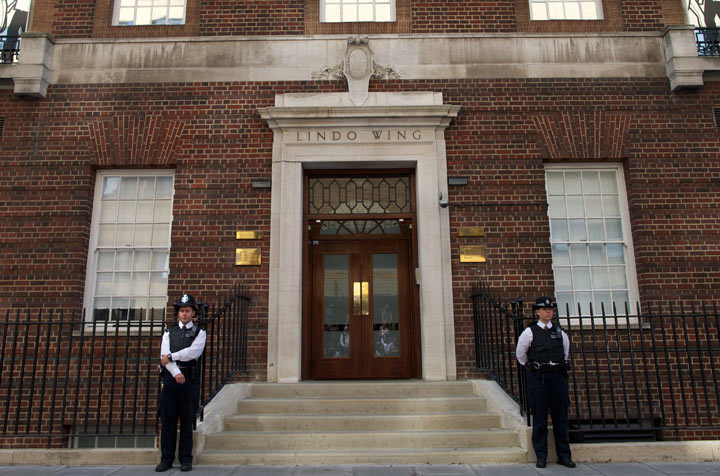 Police officers guard the door of The Lindo Wing of Saint Mary's Hospital in Paddington, west London on July 22, 2013.
