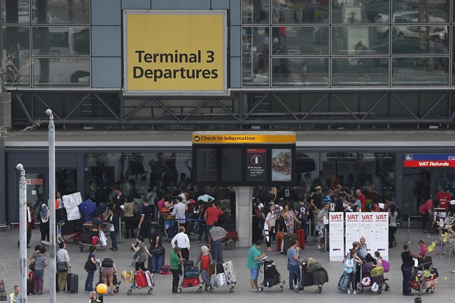 Passengers queue outside Terminal 3 at Heathrow Airport in London, Friday, July 12, 2013. As Brexit approaches, some Conservative British MPs are arguing Britain should fast track tourist visas and loosen restrictions on work permits for Canadians and other Commonwealth citizens.