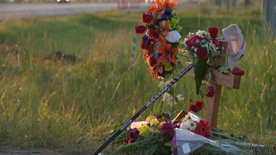 A roadside memorial expresses the grief of family and friends after the death of Derek Bossuyt in a crash Monday.