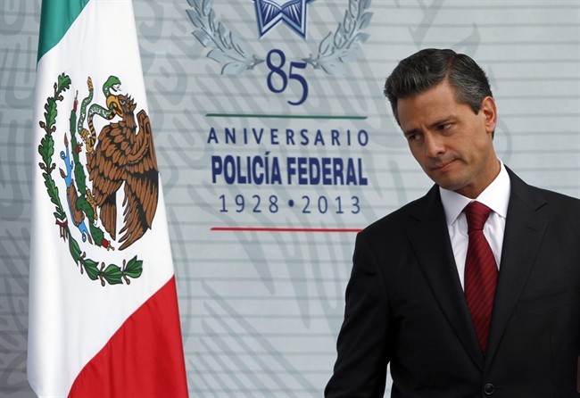 Mexico's President Enrique Pena Nieto attends a ceremony marking the anniversary of the federal police at the federal police intelligence center in Mexico City, Friday, July 12, 2013.