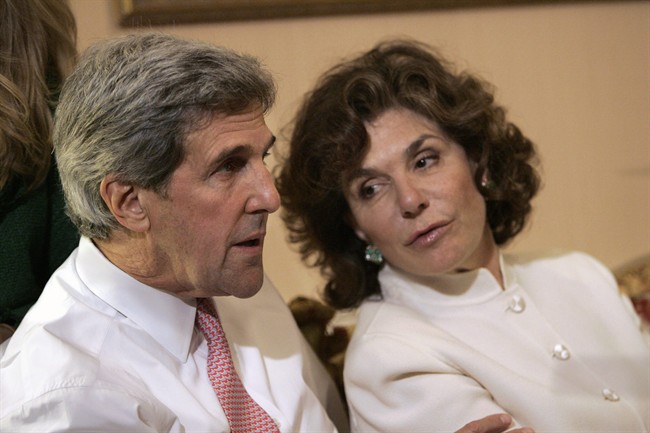 FILE - In a Tuesday, Nov. 4, 2008 file photo, Sen. John Kerry, D-Mass, left, talks with his wife Teresa Heinz Kerry while watching election results at a hotel in Boston.
