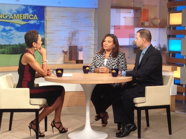 This image released by ABC shows host Robin Roberts, left, with Juror B29 from the George Zimmerman trial, center, and attorney David Chico on "Good Morning America," in New York on Thursday, July 25, 2013.
