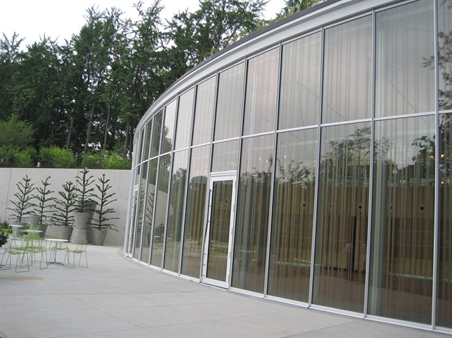This undated image provided by the American Bird Conservancy shows the new Visitors Center at the Brooklyn Botanical Gardens, which was designed with birds in mind. The special, striped pattern incorporated into the glass looks elegant, but also provides a signal to birds that a barrier exists. 