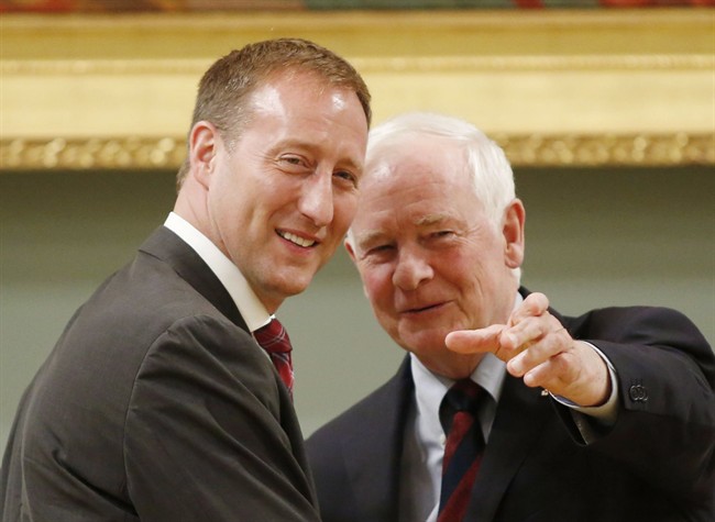 Peter MacKay, left, and Governor General David Johnston smile after MacKay is sworn in as Minister of Justice at Rideau Hall in Ottawa on Monday, July 15, 2013. THE CANADIAN PRESS/ Patrick Doyle.