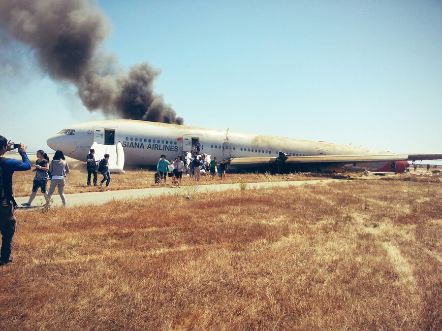Passengers are evacuated from a Boeing 777 after it crashed at SFO Saturday. 