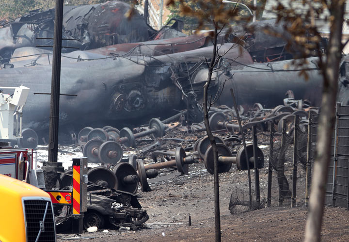 A wrecked train smoulders on Sunday, July 7, 2013 in Lac-Megantic, Que.