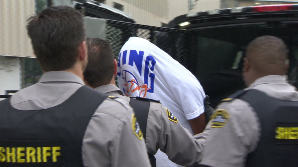 Randy Desmond Riley, 21, exits a Halifax Regional Police transport vehicle. He and Nathan Tremain Johnson appeared in court today, charged with the 2010 murder of Donald Chad Smith. (July 25, 2013).