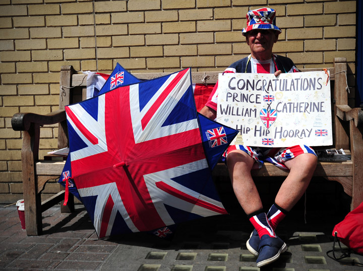 Royal well-wisher Terry Hutt poses for a picture as he waits outside the Lindo Wing of Saint Mary's Hospital in London, on July 12, 2013, where Prince William and his wife Catherine's baby will be born.