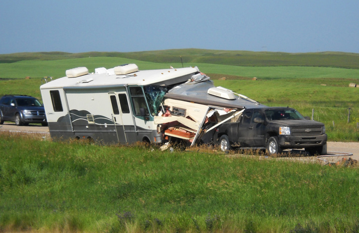 Camper left partially inside Recreational Vehicle (RV) after Saskatchewan highway collision.