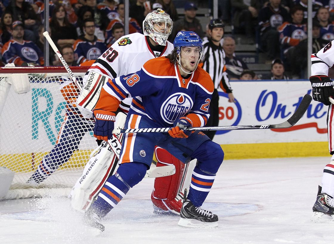 Ryan Jones #28 of the Edmonton Oilers screens goaltender Corey Crawford #50 of the Chicago Blackhawks at Rexall Place on April 24, 2013.