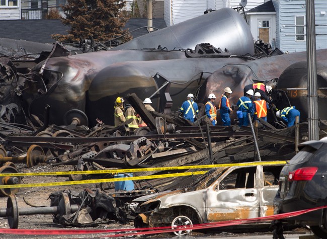 Work continues at the crash site of the train derailment and fire Tuesday, July 16, 2013 in Lac-Megantic, Que.